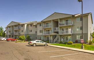 Building Exterior and Parking Lot at FOREST CREEK APARTMENTS, Spokane, WA 99208