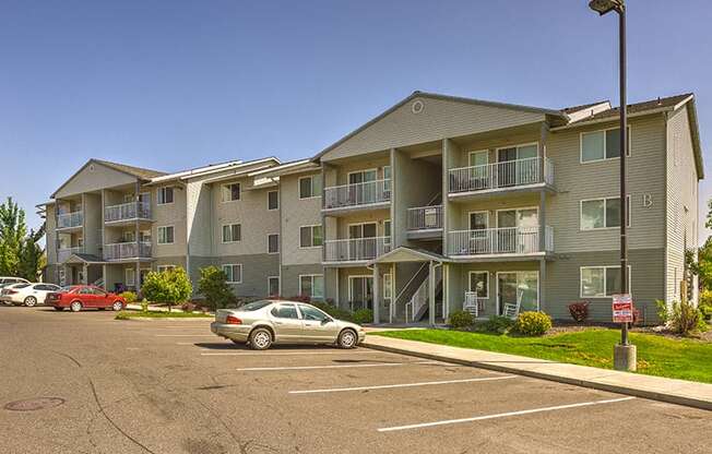 Building Exterior and Parking Lot at FOREST CREEK APARTMENTS, Spokane, WA 99208