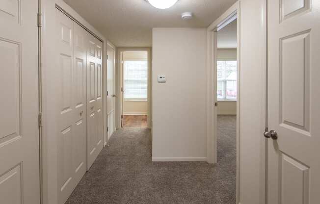 This is photo of the entryway looking towards the bathroom in the 852 square foot, 1 bedroom Fairlawn floor plan at Trails of Saddlebrook Apartments in Florence, KY.