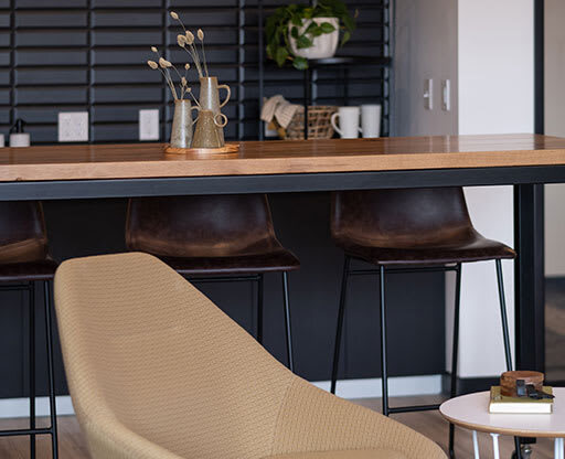 a chair is sitting in front of a table at The Landing at 1001 NP, Fargo, ND 58102