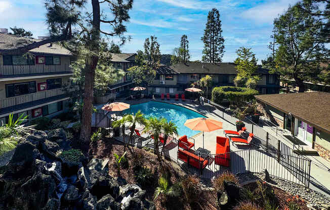 a view of the pool at the resort on a sunny day