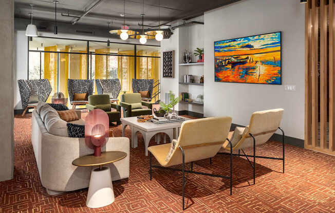 A modern living room with a large painting on the wall.