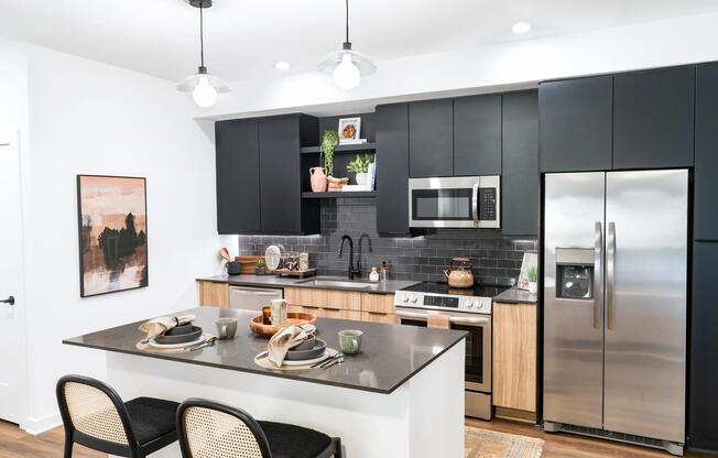 Our thoughtfully designed kitchen features a generous island, stainless appliances, and refined finishes that elevate everyday gatherings.