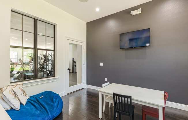 a living room with a couch and a table and a tv