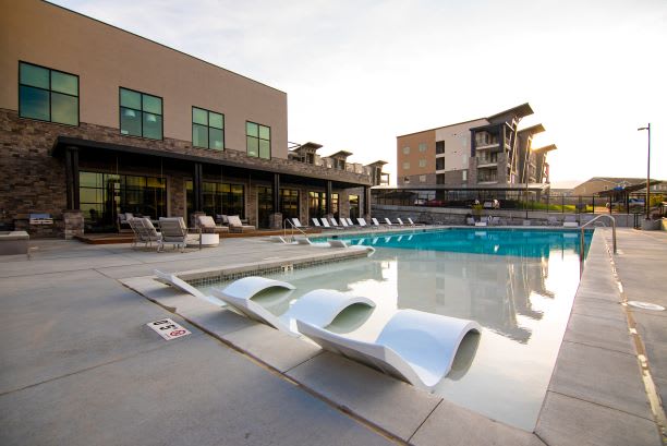 Pool Side Relaxing Area With Sundeck at Soleil Lofts Apartments, Utah, 84096