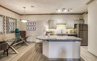 our apartments offer a kitchen and living room with a granite counter top