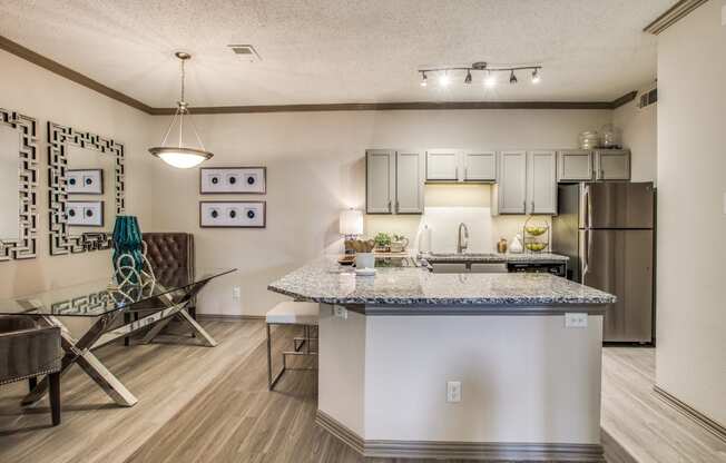 our apartments offer a kitchen and living room with a granite counter top