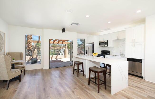 a kitchen with a wood floor in a room