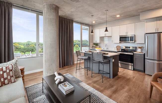 a living room with a kitchen and a dining room