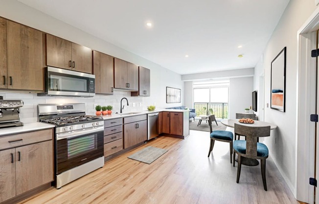 a large kitchen with wooden cabinets and stainless steel appliances