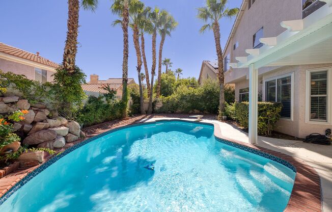 2 Story Summerlin Home with Refreshing Pool & Lush Landscaping