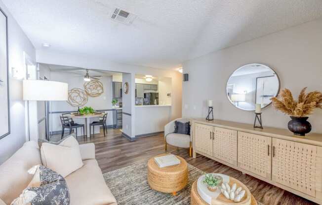 a living room with couches and chairs and a table