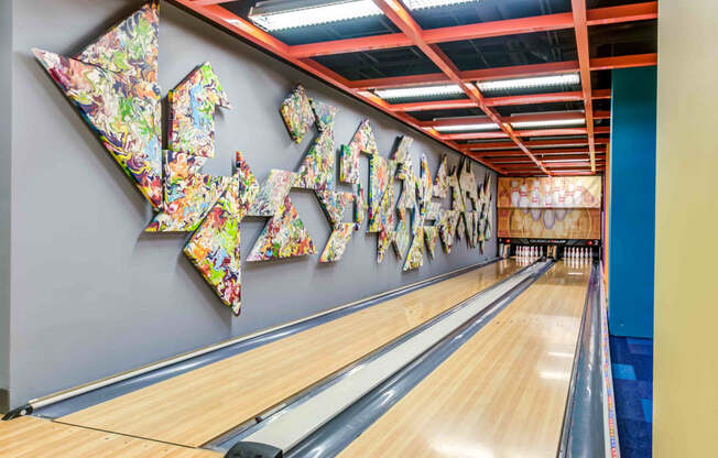 Bowling alley with art installation on wall