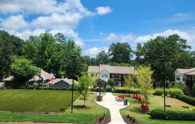 New green space with corn hole and grills