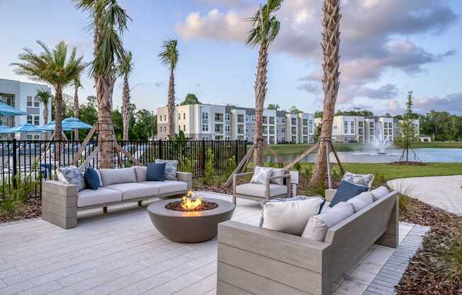 Firepit surrounded by resident and guest seating area.