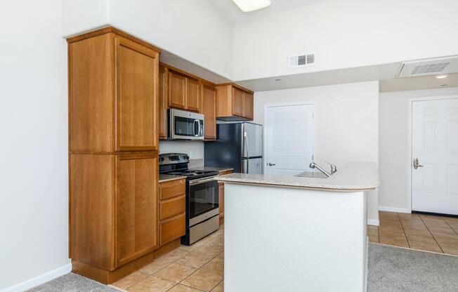 a kitchen with a stove and a refrigerator