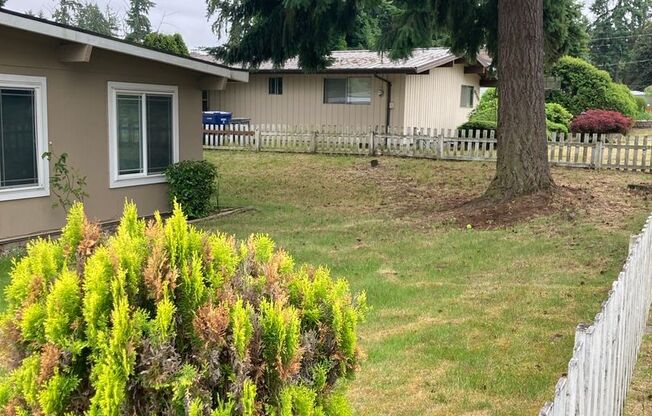 Cozy 4-Bedroom 1.5 Bath Gem with Fenced Yard & Playhouse Fun