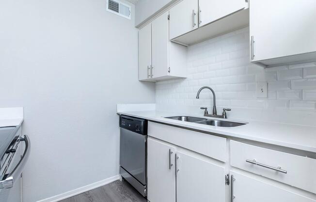 a kitchen with a stove and a sink
