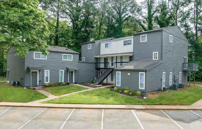 our apartments are located in a quiet neighborhood with trees and a parking lot