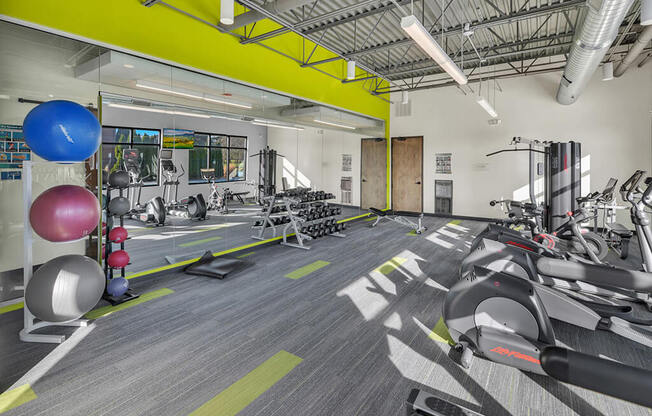 a photo of the gym at the residences at omni louisville apartments
