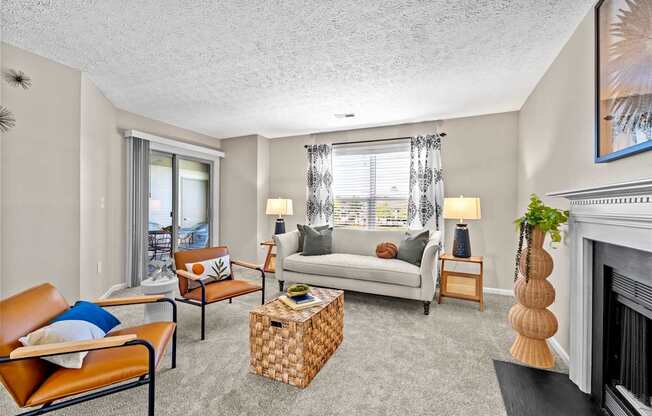 A living room with a fireplace and a couch.