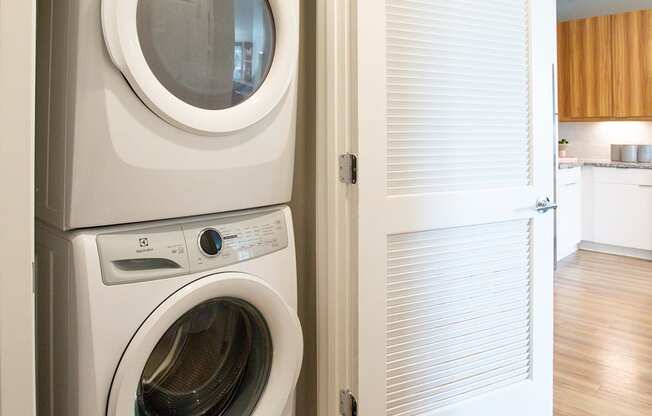 a small laundry room with a washer and dryer