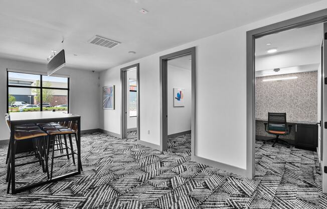 a room with a table and chairs in it