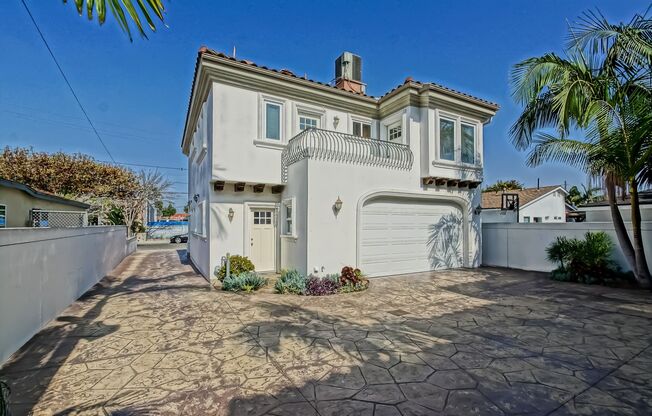SPACIOUS & BRIGHT, TWO-STORY HOME W/ FRONT YARD, BALCONY & 2-CAR GARAGE CLOSE TO SHOPPING, FREEWAY ACCESS, RB BORDER & MINS TO BEACH!