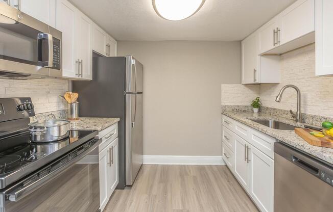 a large kitchen with stainless steel appliances