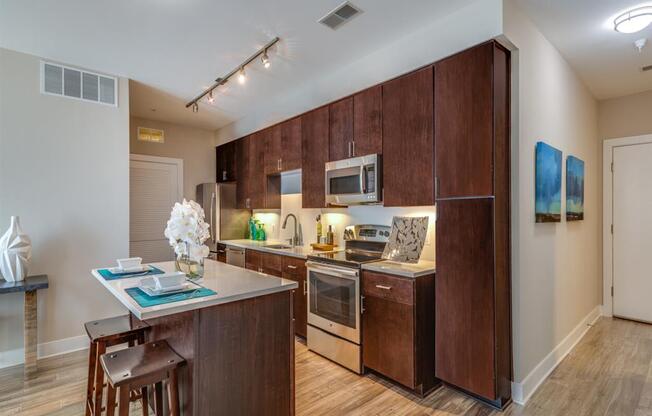 a kitchen with wooden cabinets and a counter top