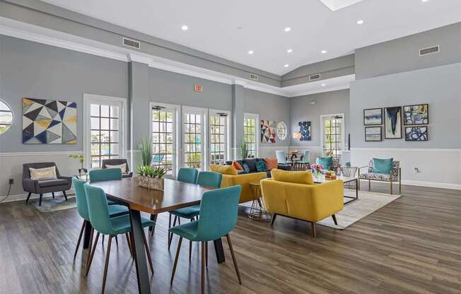 a living room with a table and chairs