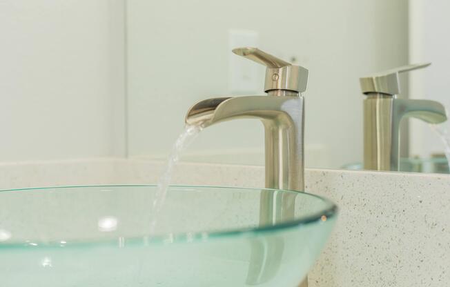 a glass with a blue sink