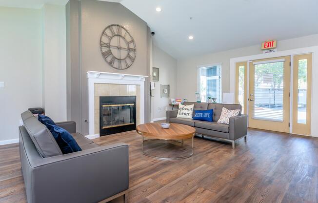 a living room filled with furniture and a large window