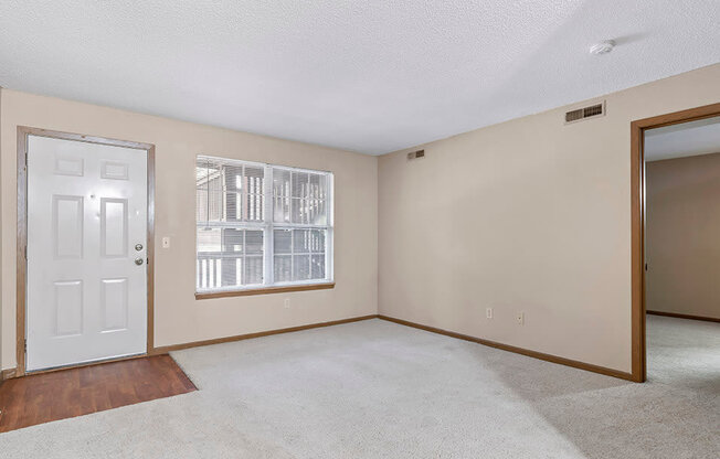 a bedroom with a door and a window