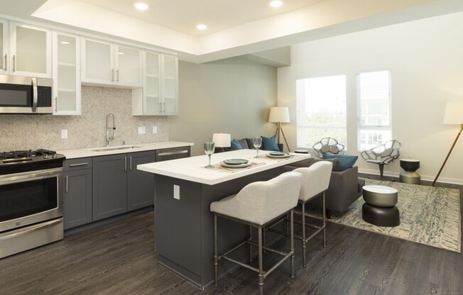 Kitchens feature bar seating, stainless steel appliances and gas ranges