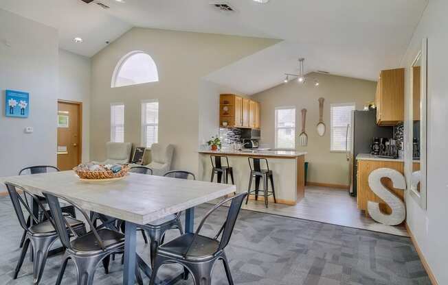 Dining space and community kitchen in the clubhouse at Skyline View apartments