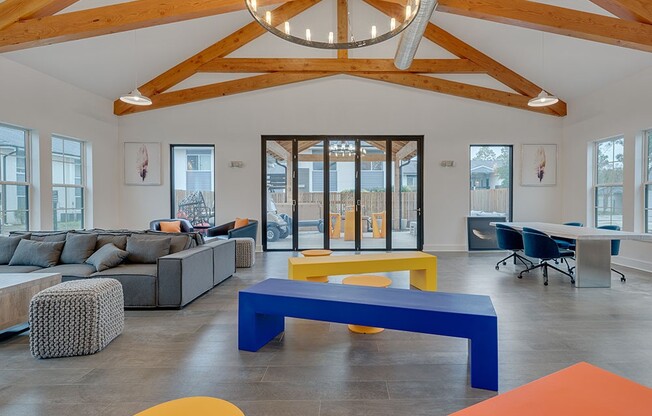Step into the vibrant common area of Crossings @ 501 Apartments, featuring modern furnishings and a bright, open design perfect for socializing or relaxation. This inviting space is ideal for both work and play. Schedule your visit today!
