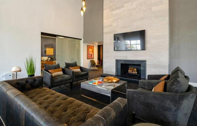 a living room filled with furniture and a fire place