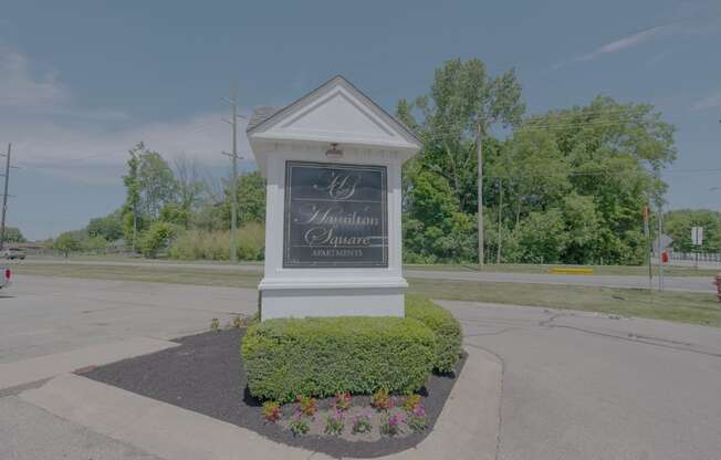 the sign at the intersection of a street with a parking lot