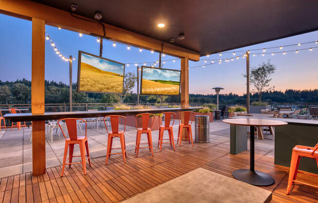 The Merc Apartments Outdoor Terrace Bar Top Tables and Televisions