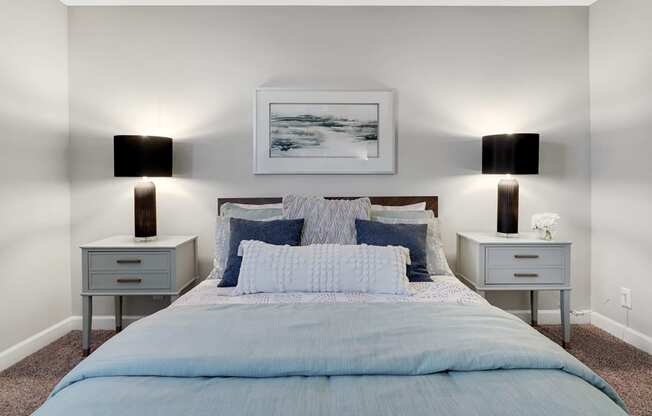 a bedroom with a bed and two night stands at Stonewater Apartments, Louisville, KY 40241