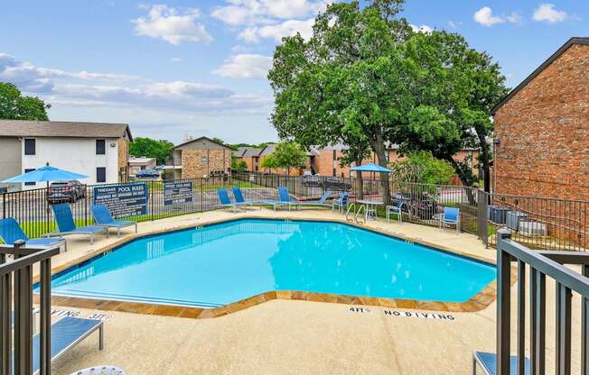 A pool with a no diving sign on the side.