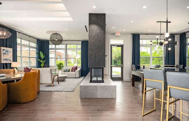 A modern living room with a fireplace and a dining table.