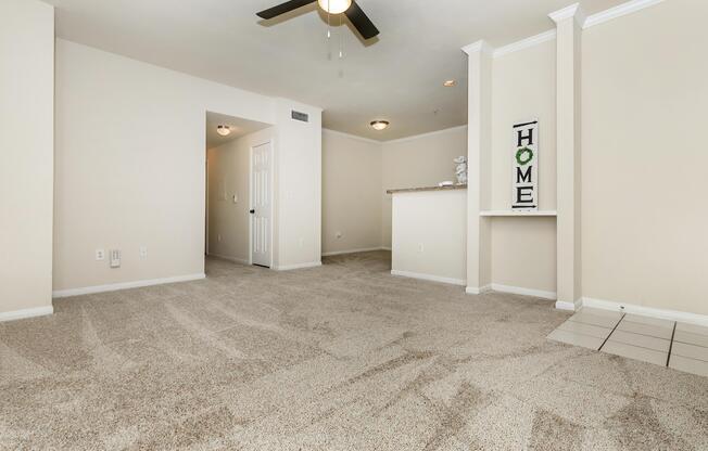 carpeted living room and dining room