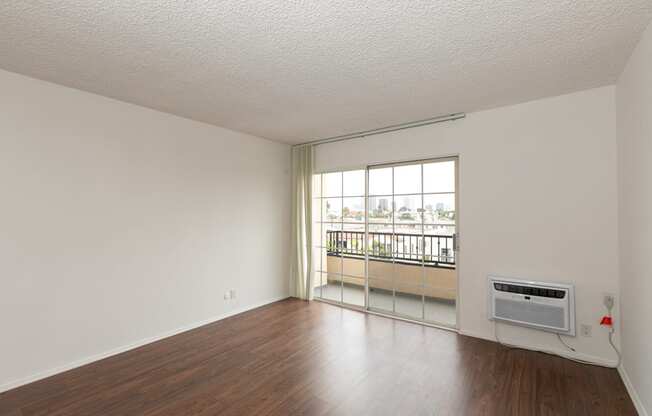 Living Room with Hardwood Floors and Patio Doors