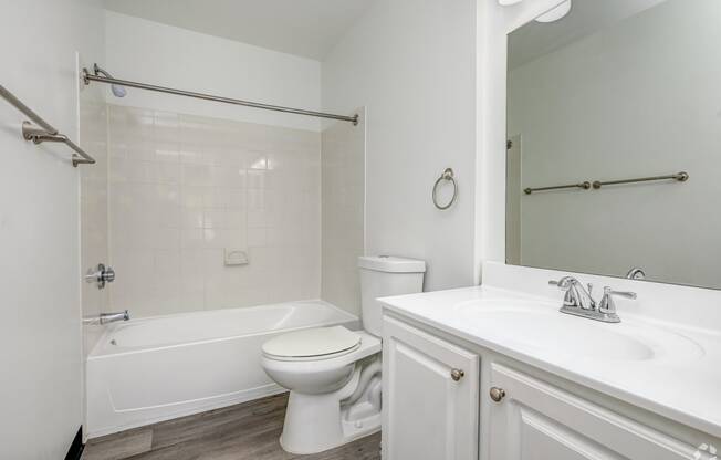 a bathroom with a sink toilet and a bath tub