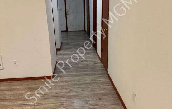 A nice house with 3 beds rooms and 1.5 baths.