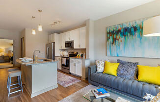 room with couch and kitchen island at 1010 Dilworth Apartments, Charlotte