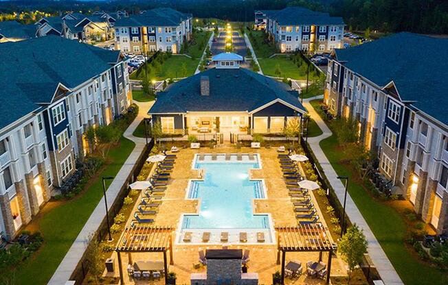 an aerial view of an apartment complex with a large swimming pool at Promenade at Newnan Crossing, Georgia