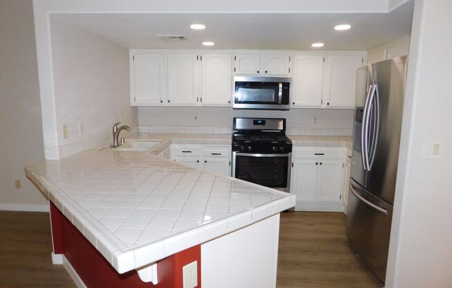 Gorgeous 3 bedroom condo with a 2 car garage! Tons of upgrades*Southwest*Gated community*